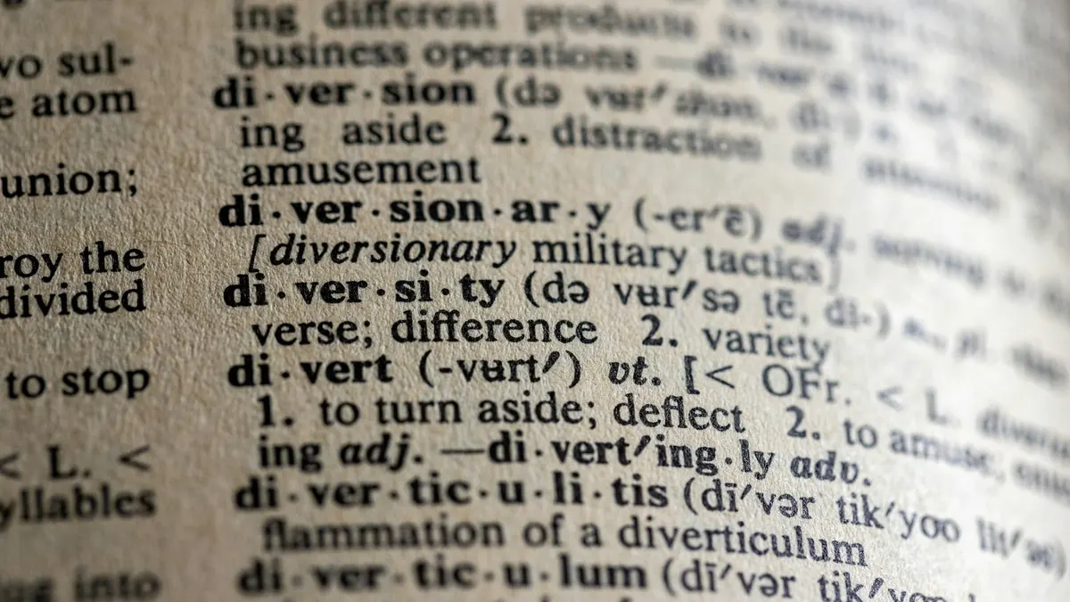 Close-up of a printed dictionary page with entries from diversion to diverticulum